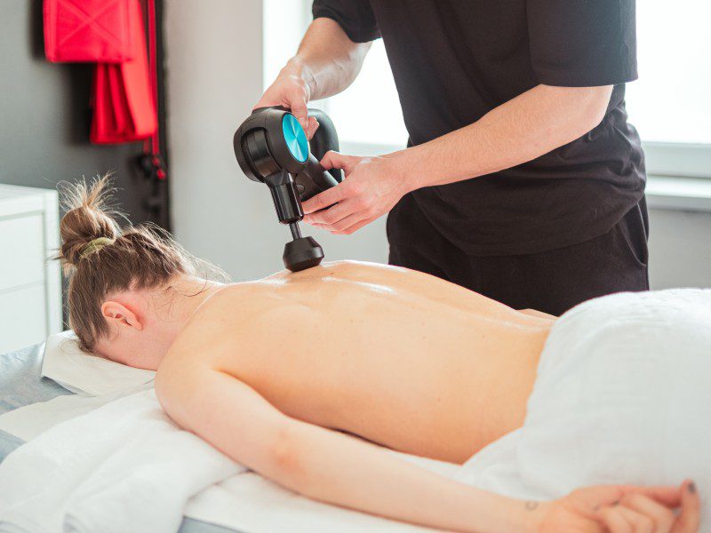 pexels-cojanu-alexandru-16134457-17 A man is using an electric device to blow up the back of his body.
